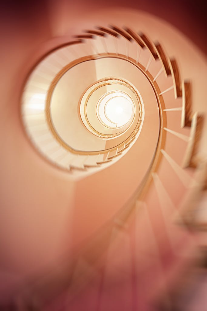 A mesmerizing spiral staircase captured in a soft blur, creating a dreamy effect.